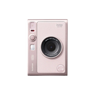 White instant camera with 'instax' branding on a pink background
